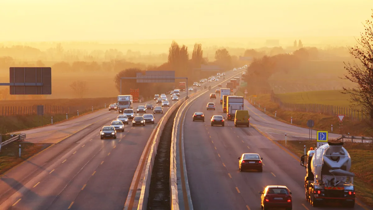 Traffic on highway with cars.