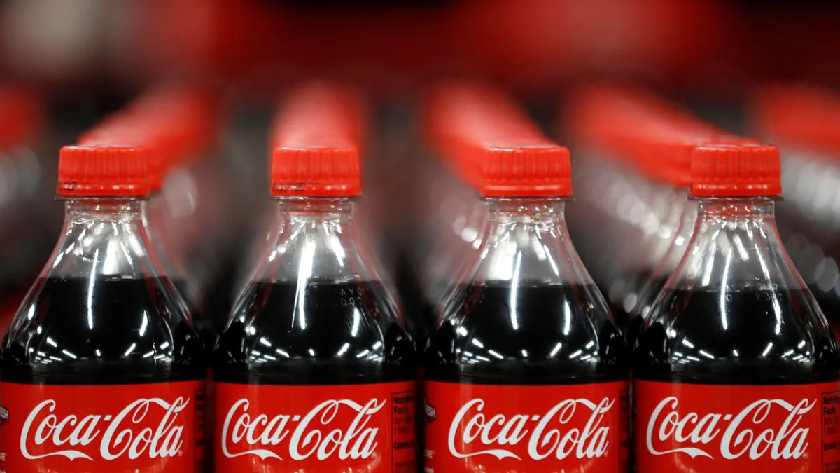 The tops of Coca-Cola soda bottles.