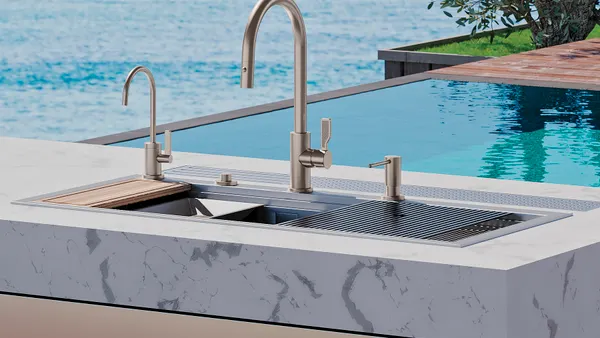 A kitchen faucet on a counter outdoors.