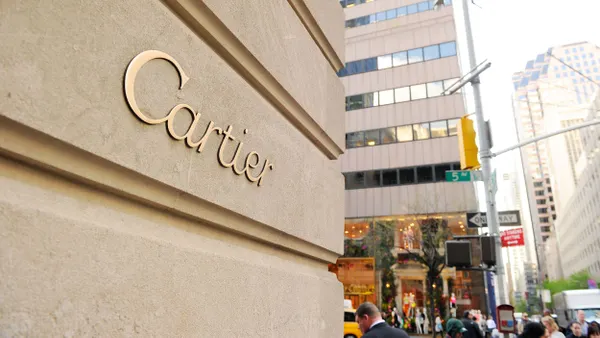 A closeup of the Cartier logo on a building.
