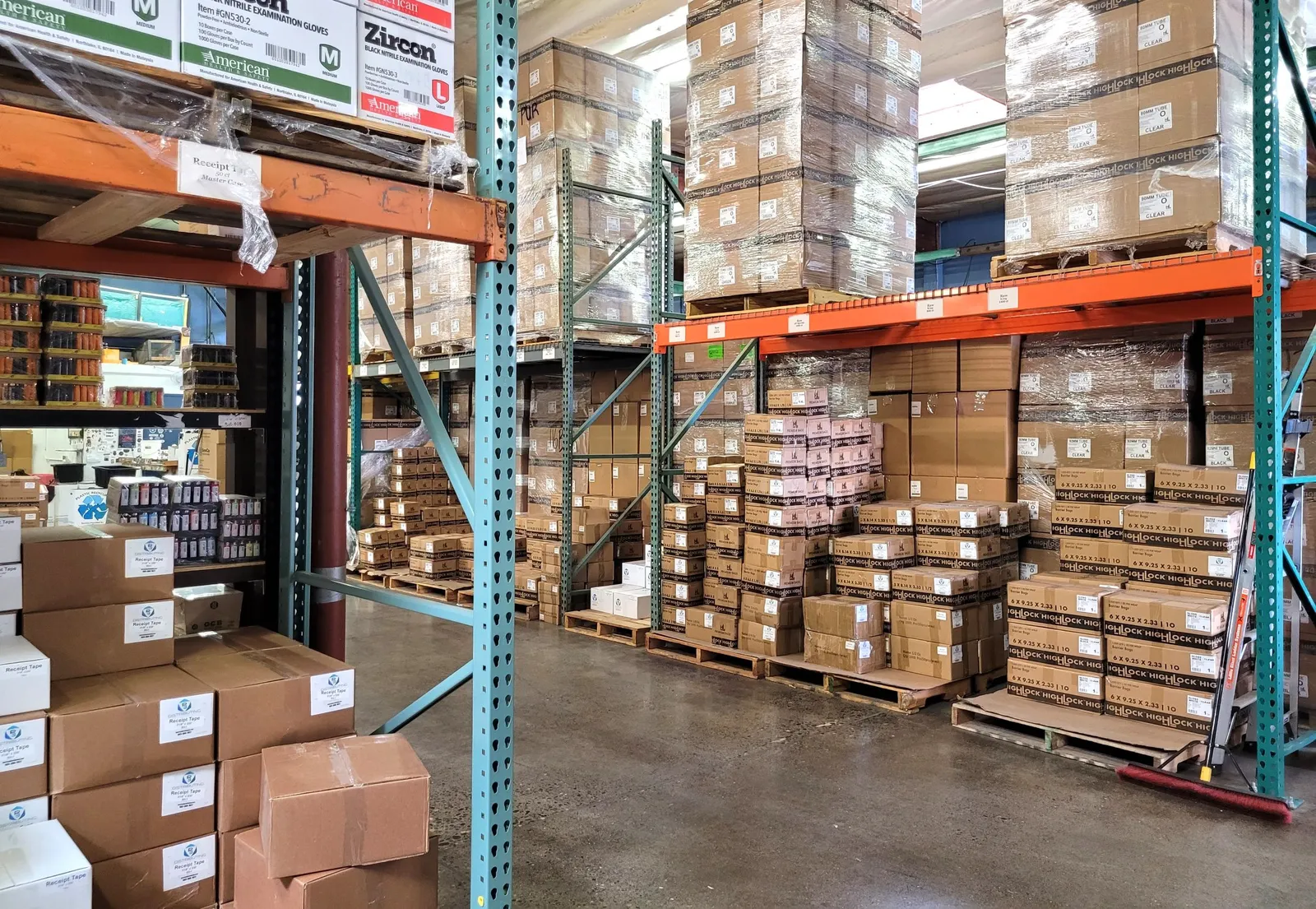 A warehouse with boxes of products stacked on shelves.