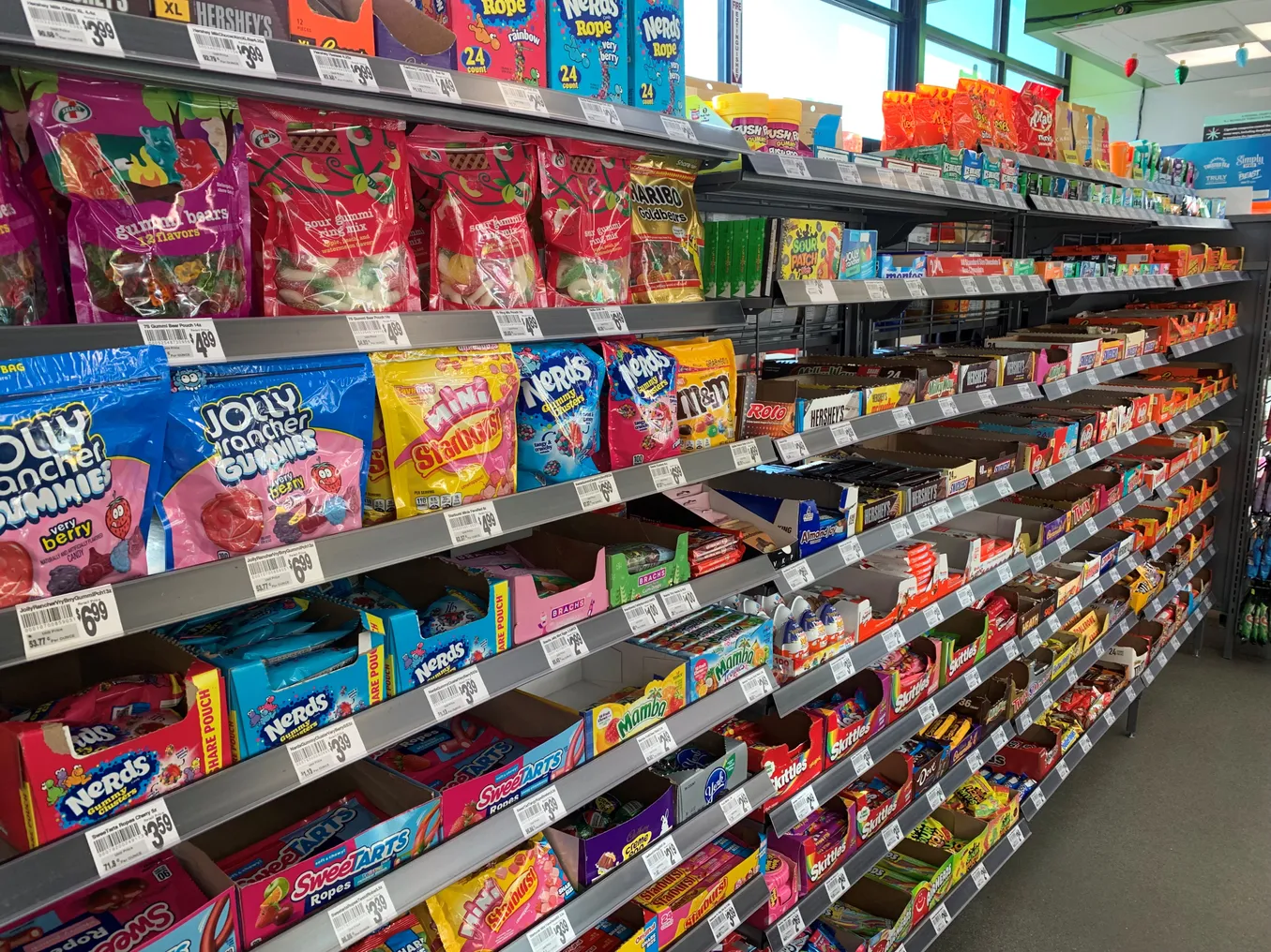 A photo of the candy aisle inside a 7-Eleven.