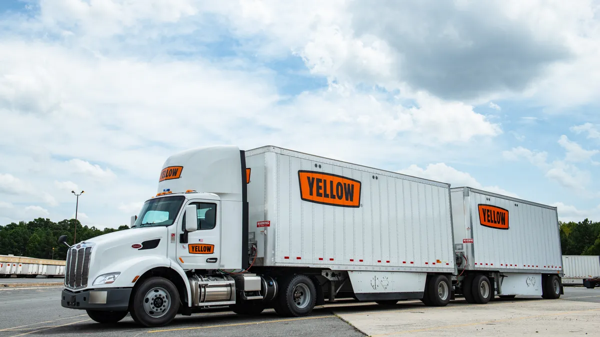 A Yellow Corp. truck is parked at a terminal.