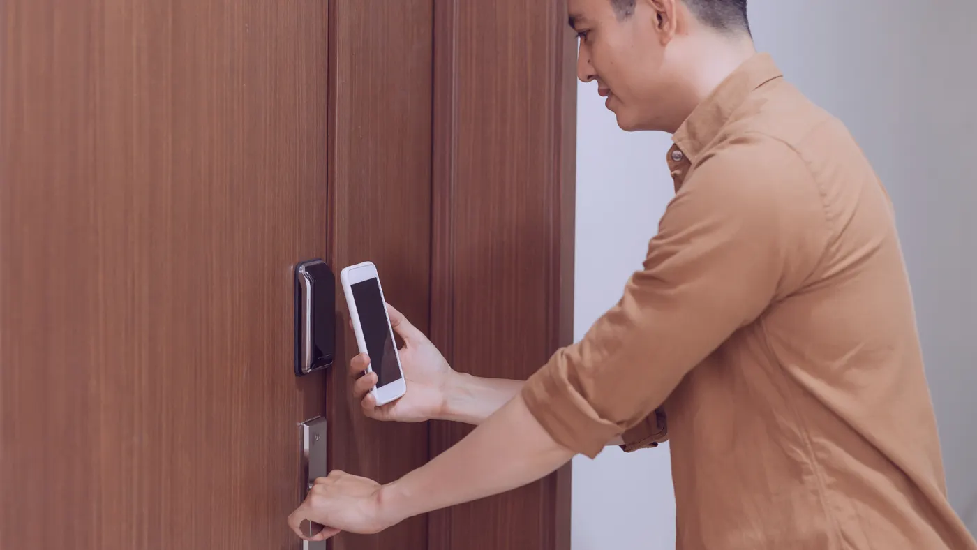 man opening door with id card
