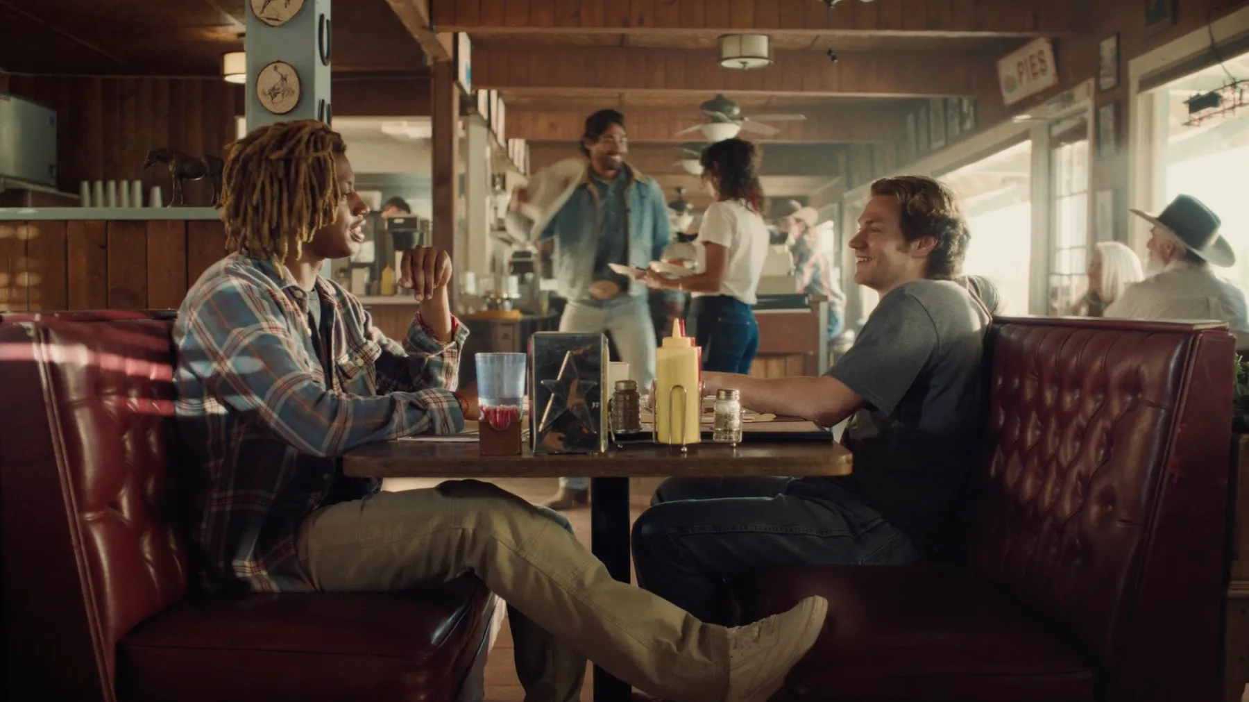 People in a diner in a Wrangler ad