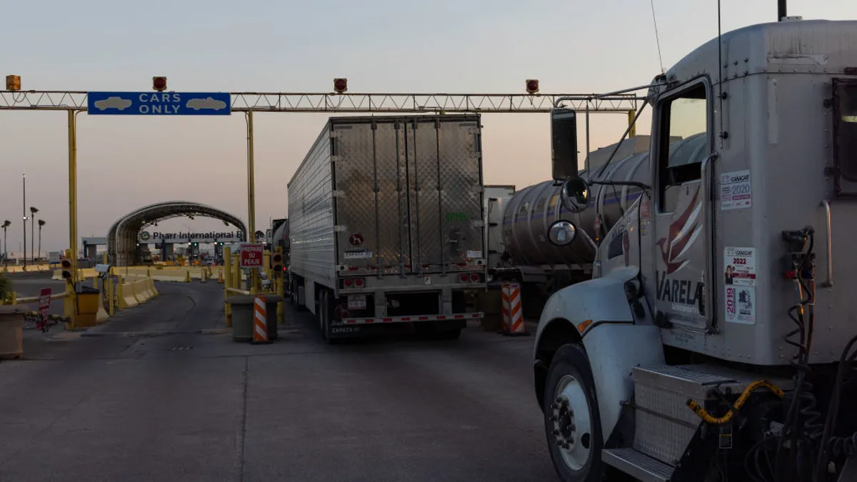 Trucks wait to cross the Mexico-U.S. border.