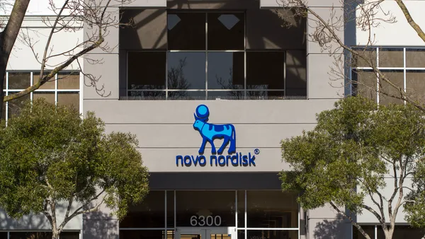 A Novo Nordisk sign is seen on the side of a building.