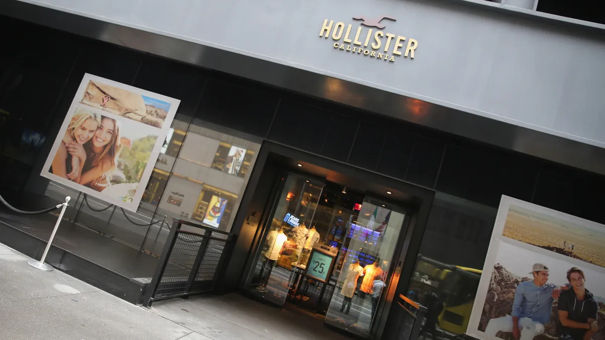 Exterior of a black and gray Hollister storefront.