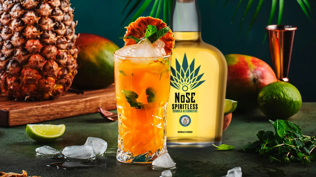 mocktail with tropical fruit in the background