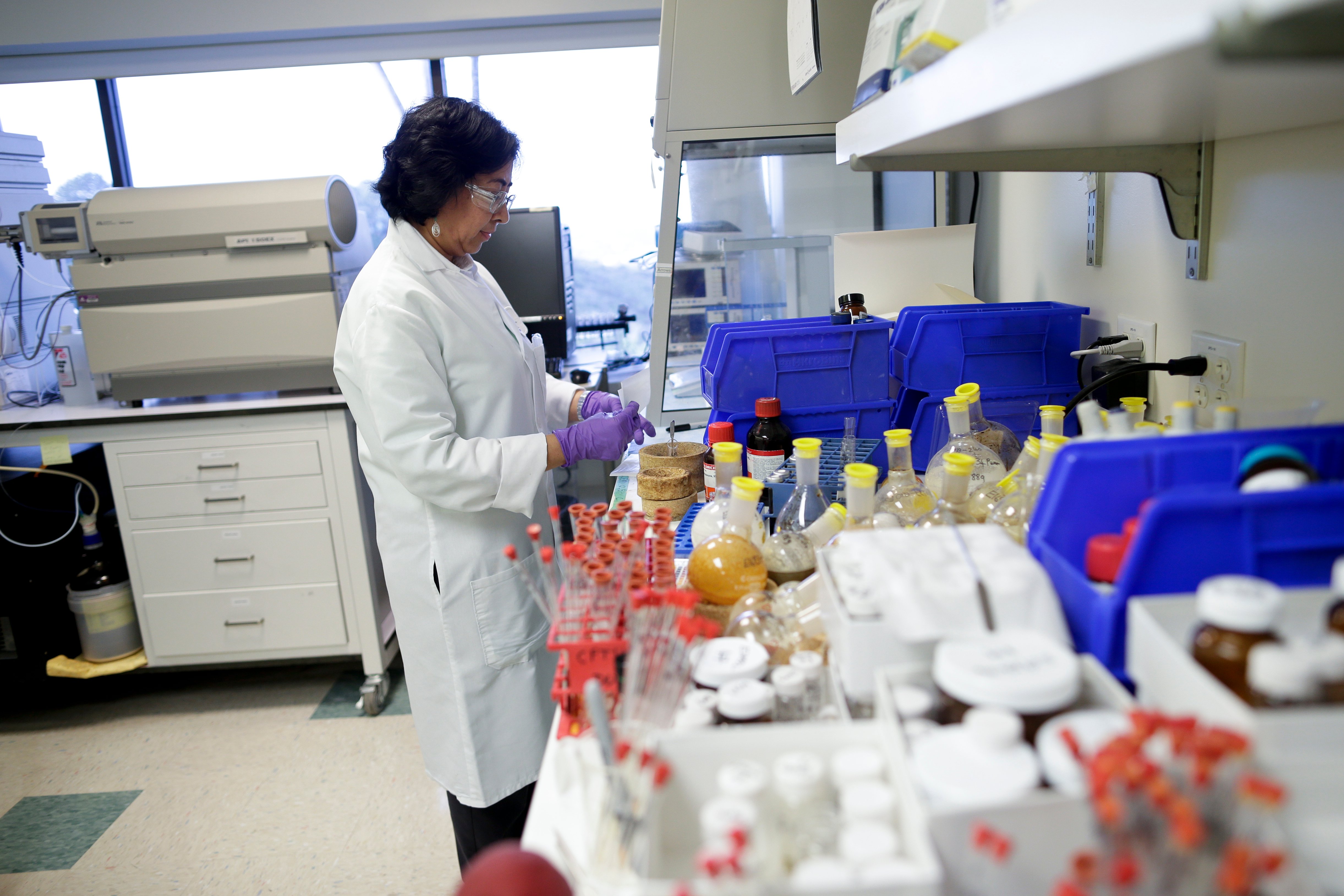 A scientist at Vertex Pharmaceuticals works in a laboratory in San Diego, California, on March 4, 2015.