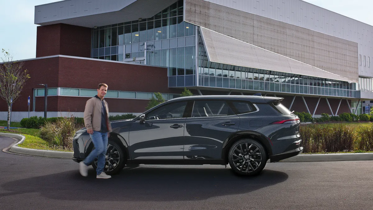 Brock Purdy stands in front of a Toyota.