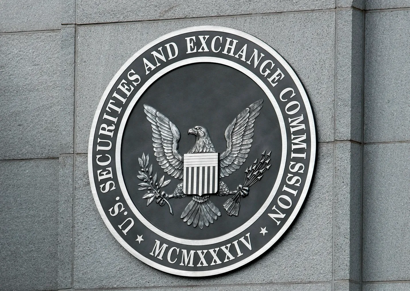 The U.S. Securities and Exchange Commission seal hangs on the facade of its building.