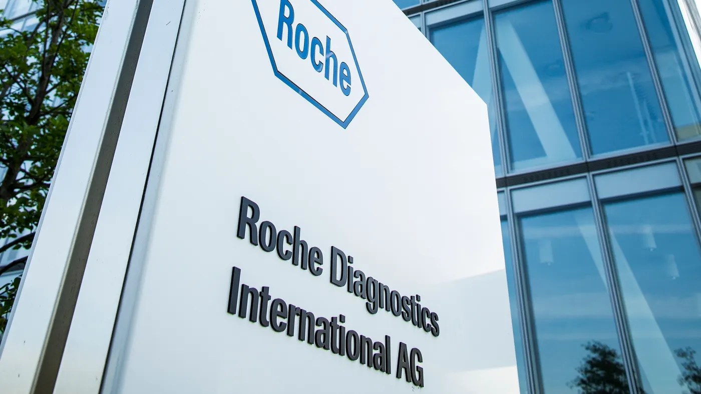 A Roche logo is seen on the side of a building.