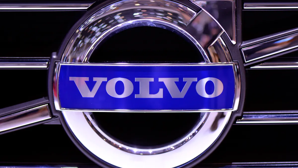 A close-up view of a Volvo logo.