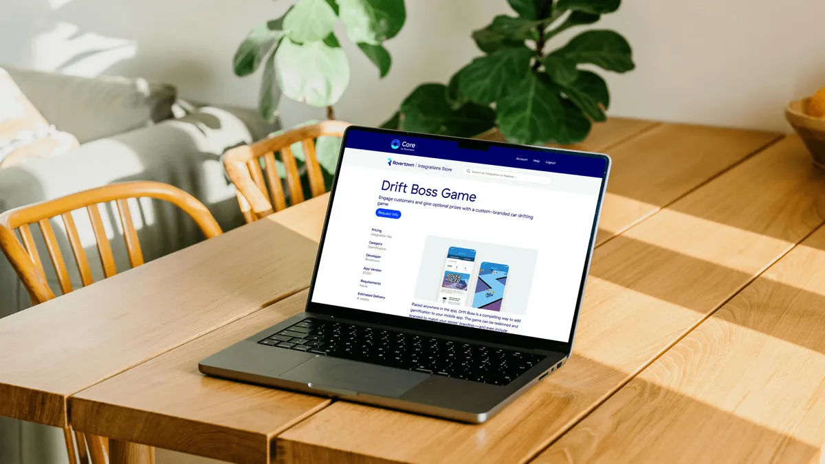 A photo of a laptop on a wooden table, showing Rovertown's Integration Store.