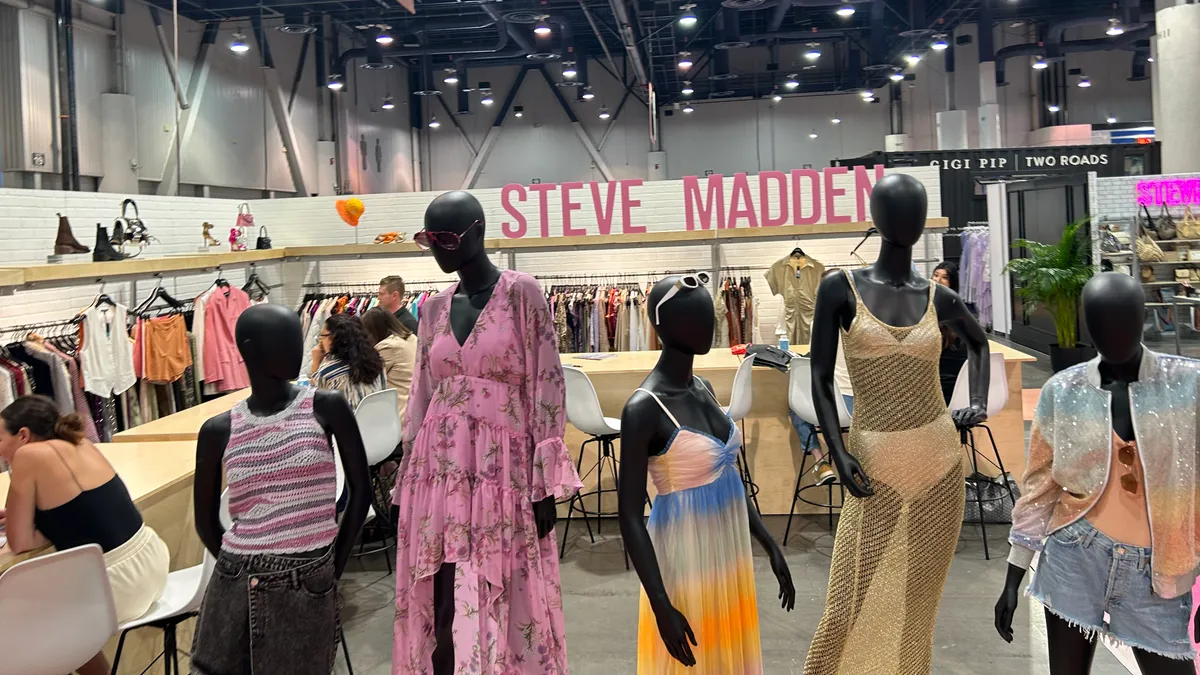 Mannequins are displayed in front of the Steve Madden logo