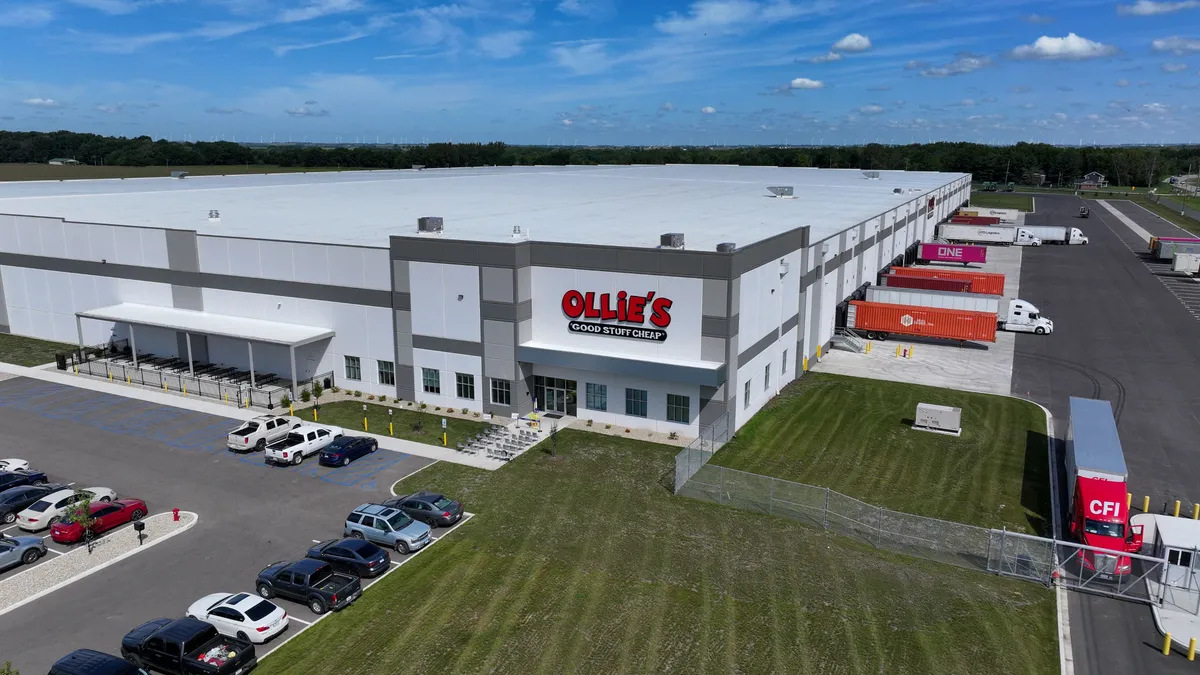 An Ollie's distribution center picture with freight trucks on the right side for cargo loading/unloading.