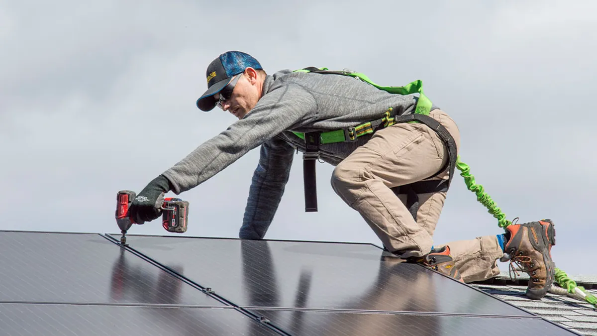 Technician setting up solar panels