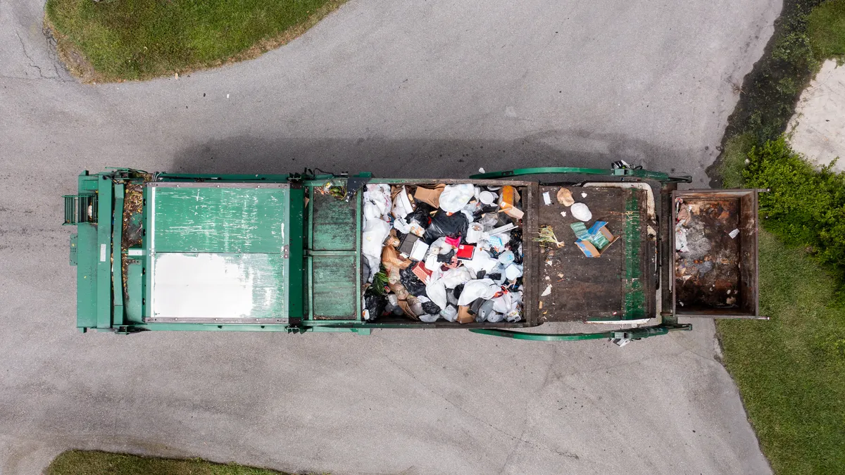 Overhead view of a truck collecting waste