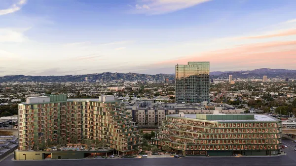 A rendering of two trapezoidal buildings.