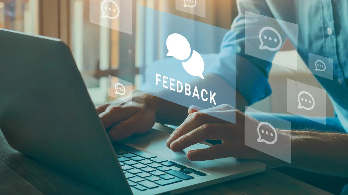 hands of a person giving feedback online