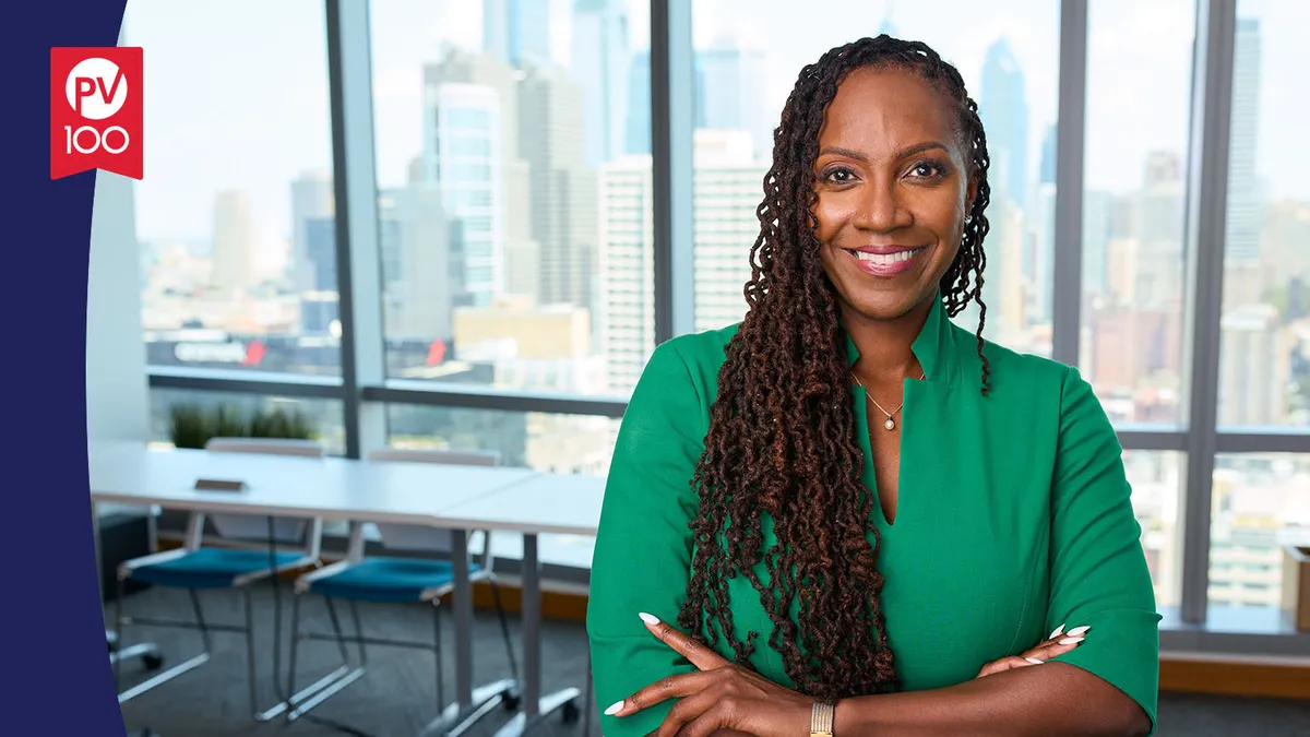 A portrait of Dr. Tania Small framed with a banner icon that reads "PV 100"