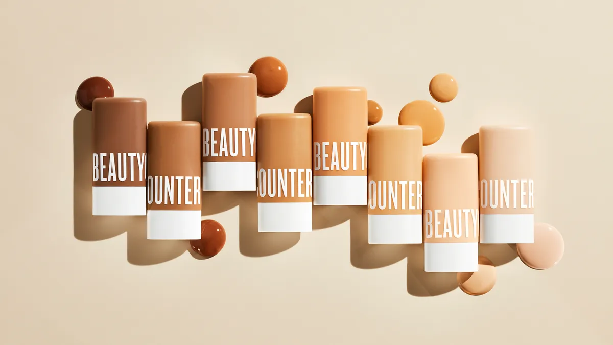 A line of Beautycounter products in various skin tone shades.