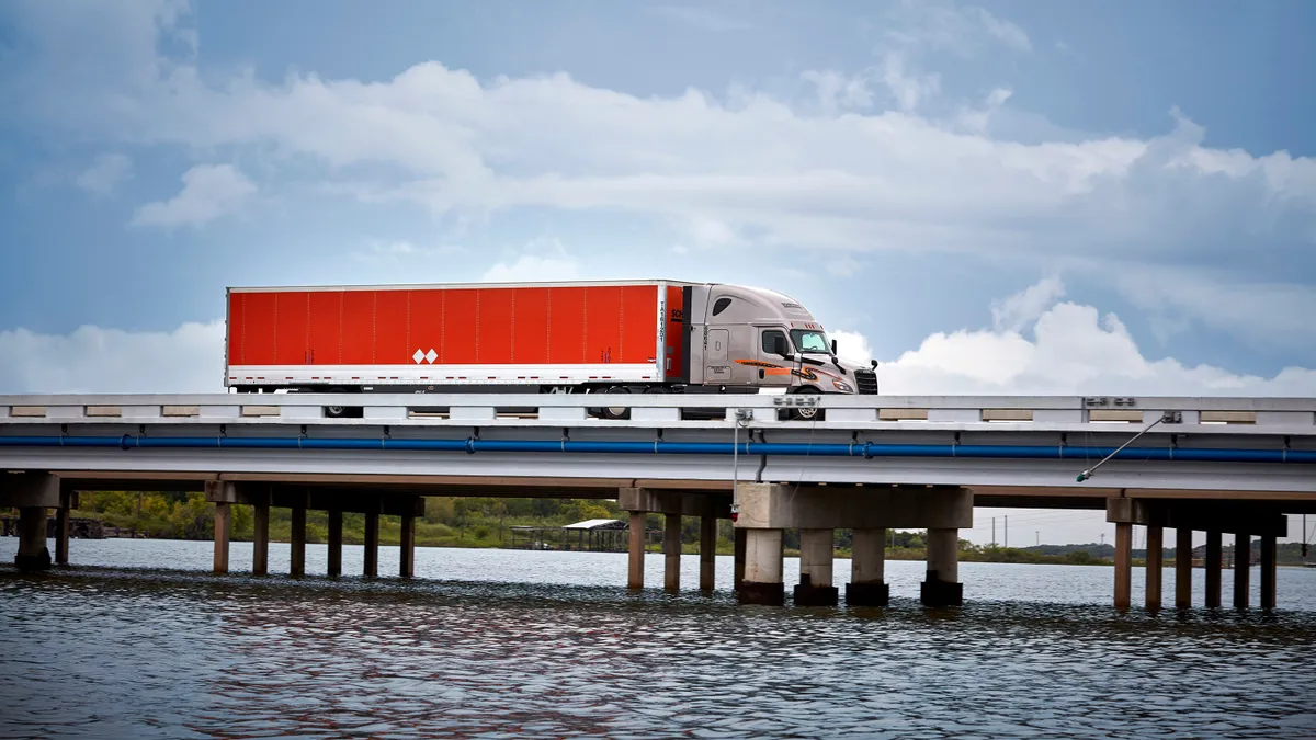 Schneider National truck on bridge