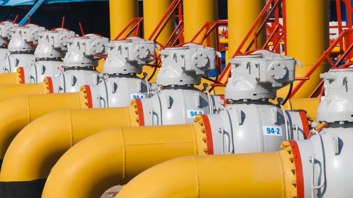 Pipes and valves are on the gas compressor station