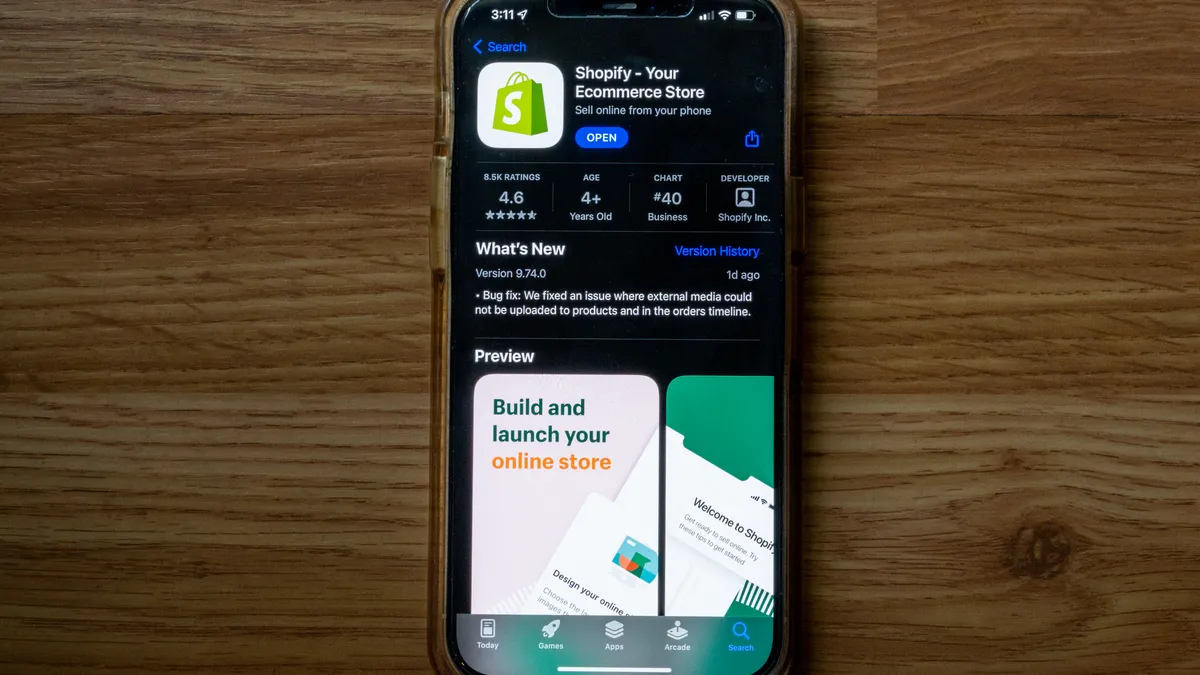 The Shopify app store page is displayed on a smartphone.