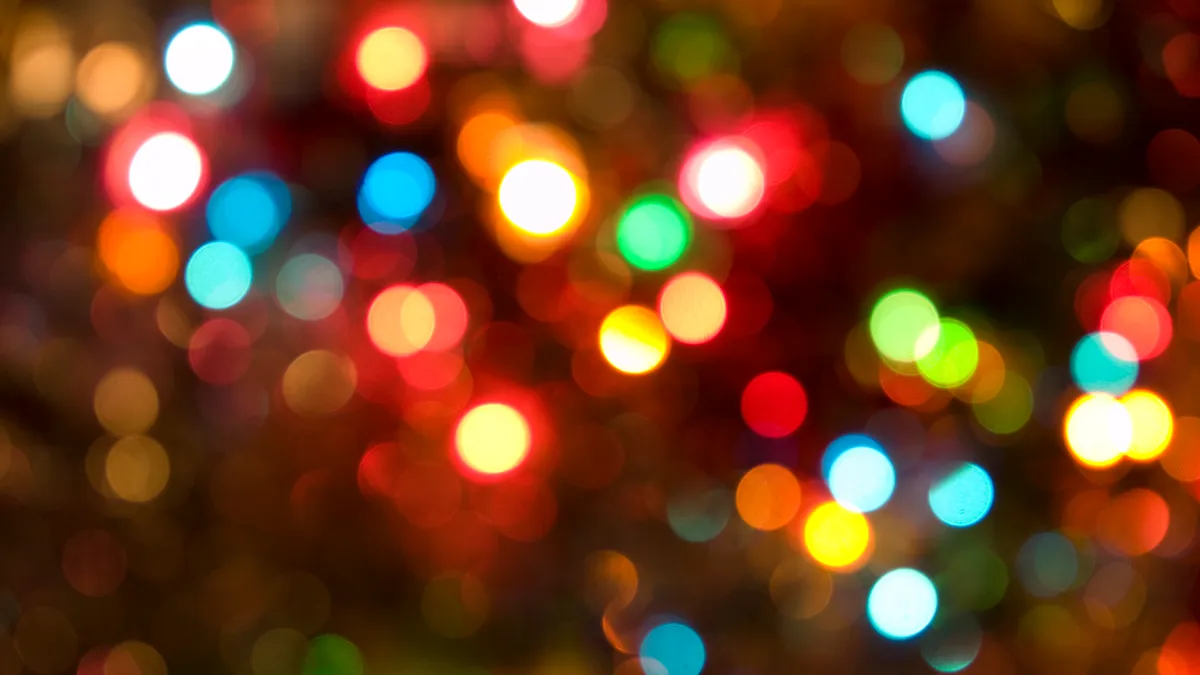 defocused holiday lights in many colors