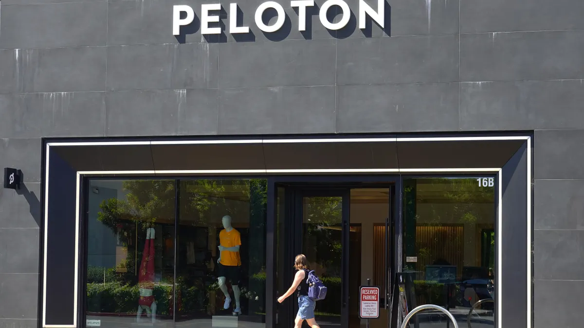 A pedestrian walks by a Peloton store on May 08, 2024 in Palo Alto, California.