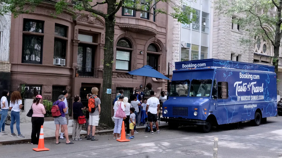 People line up at Bookings.com food truck.