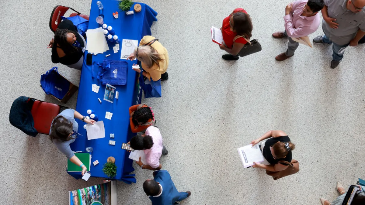 an overhead shot of jobseekers at a job fair