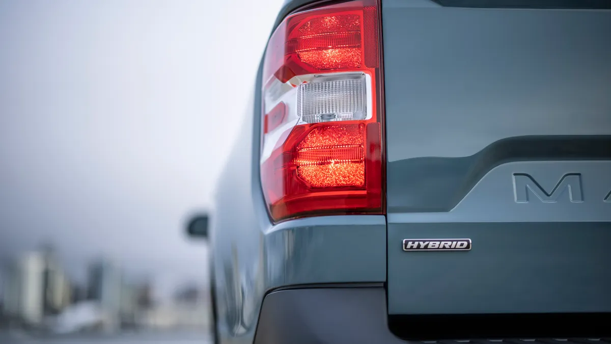 A view from behind of the 2022 Ford Maverick pickup showing the left rear tail light.