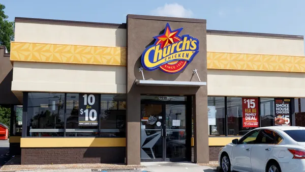 An image of a resaturant with Church's Chicken on the side of the building