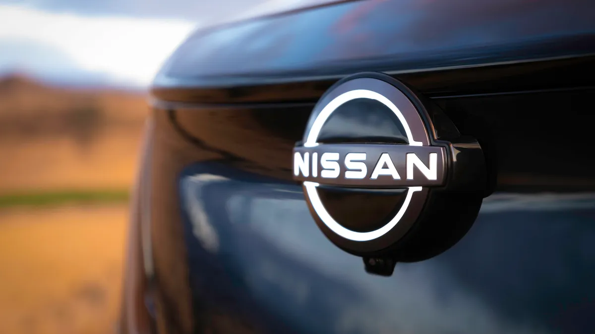 The front badge of the Nissan Aiyra electric SUV.