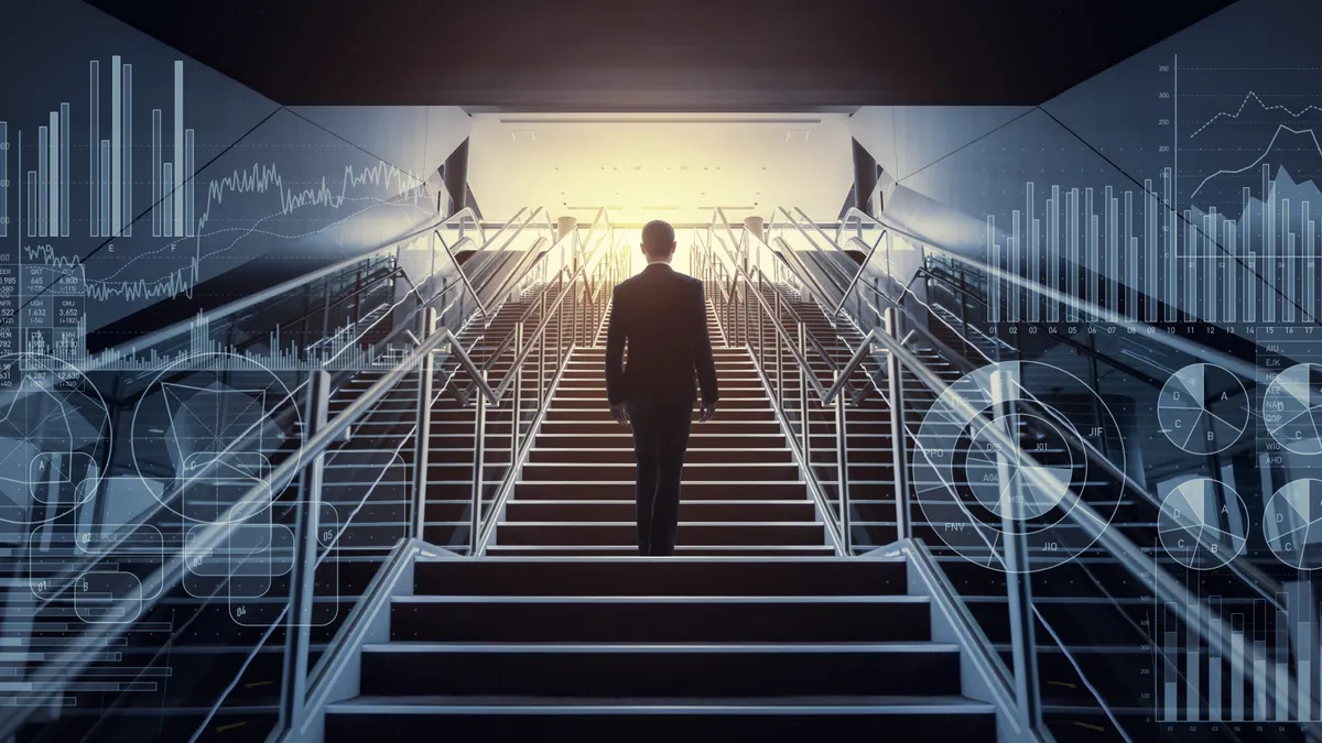 businessman rising up staircase