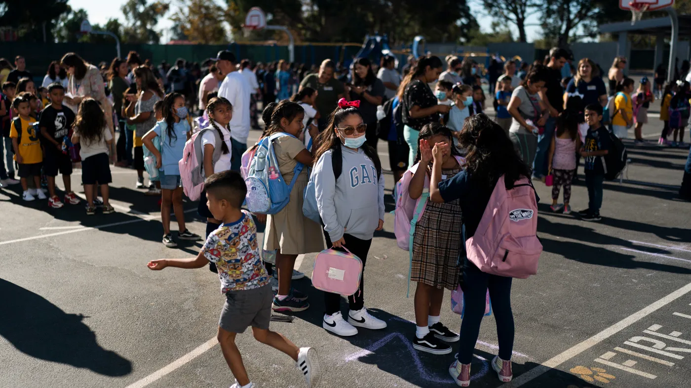 A group of students outside in a school yard.