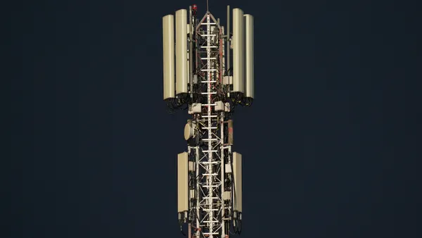 A cell tower is seen in a close-up shot
