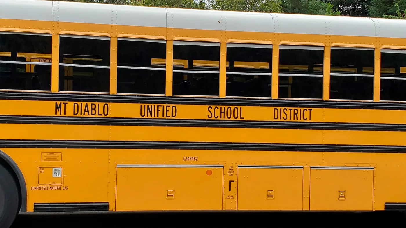 A yellow school bus with "mt diablo unified school district" written on the side.