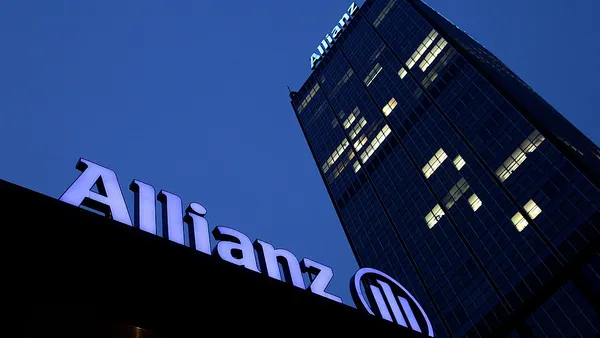 The logo of Allianz stands on two office buildings.