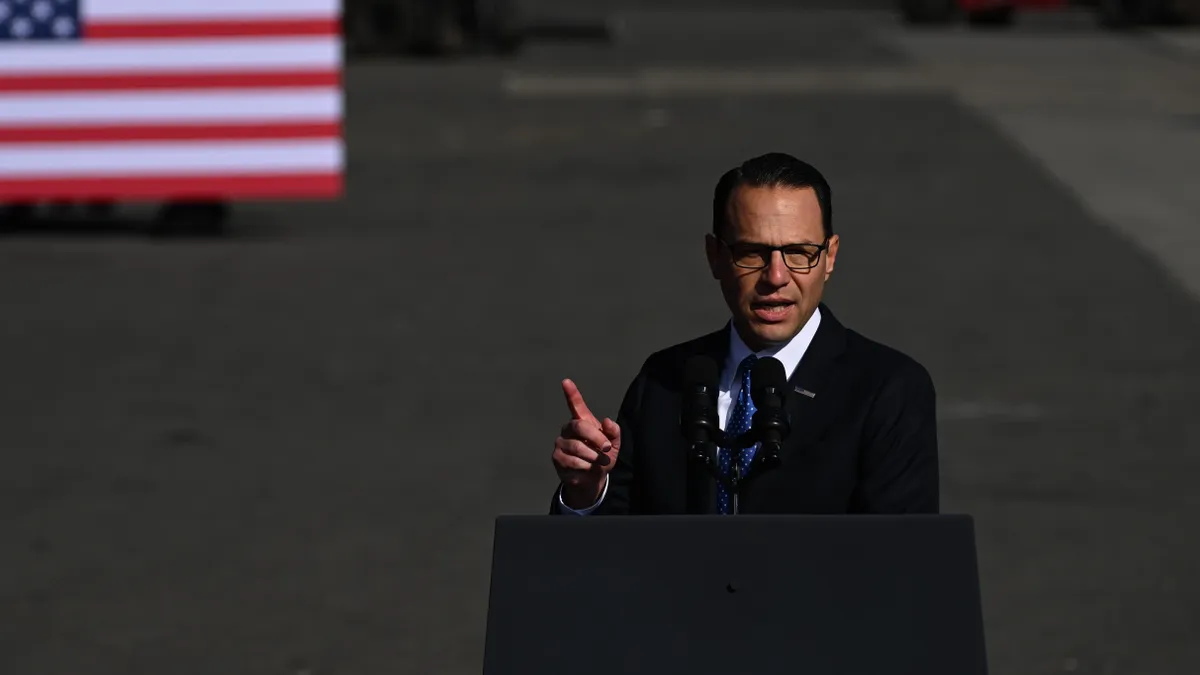 Pennsylvania Gov. Josh Shapiro speaks at a podium.