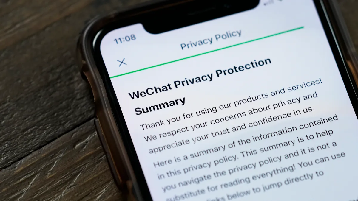 The WeChat privacy policy is displayed on an Apple iPhone.