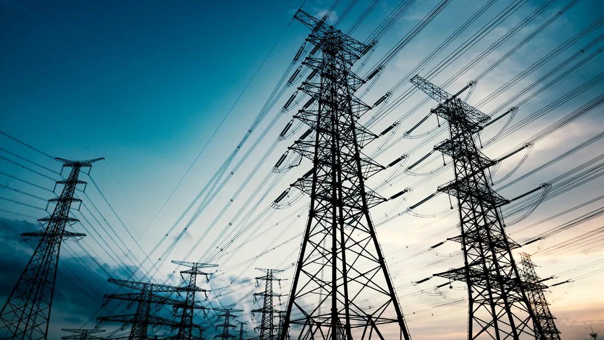 High voltage towers in the dusk of the evening