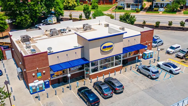 A photo of a convenience store taken from overhead. A sign above the door reads Spinx.