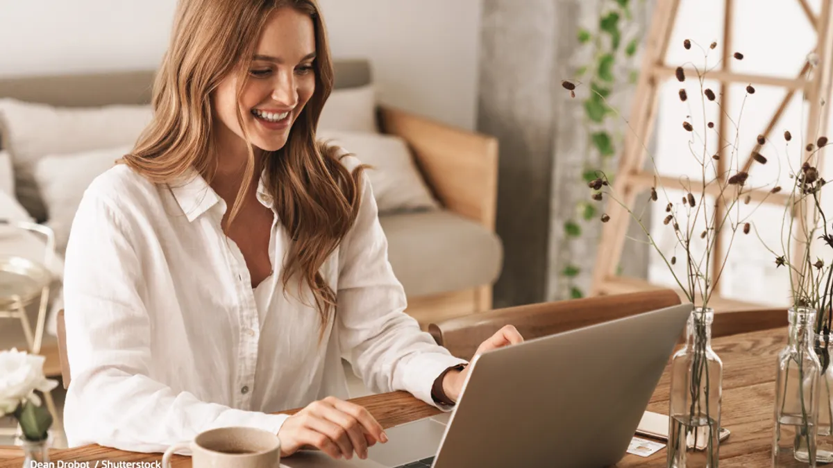Woman working on laptop at home