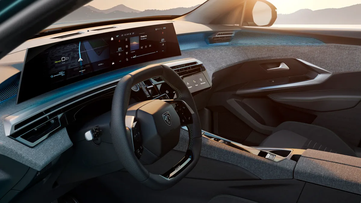 The panoramic dashboard display of the Peugeot e-3008 electric SUV.