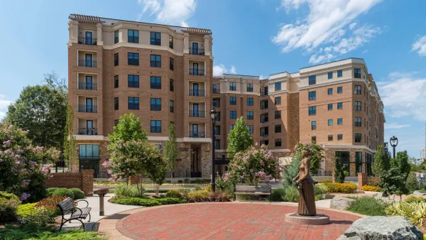 Brown-brick mid-rise apartment properties.
