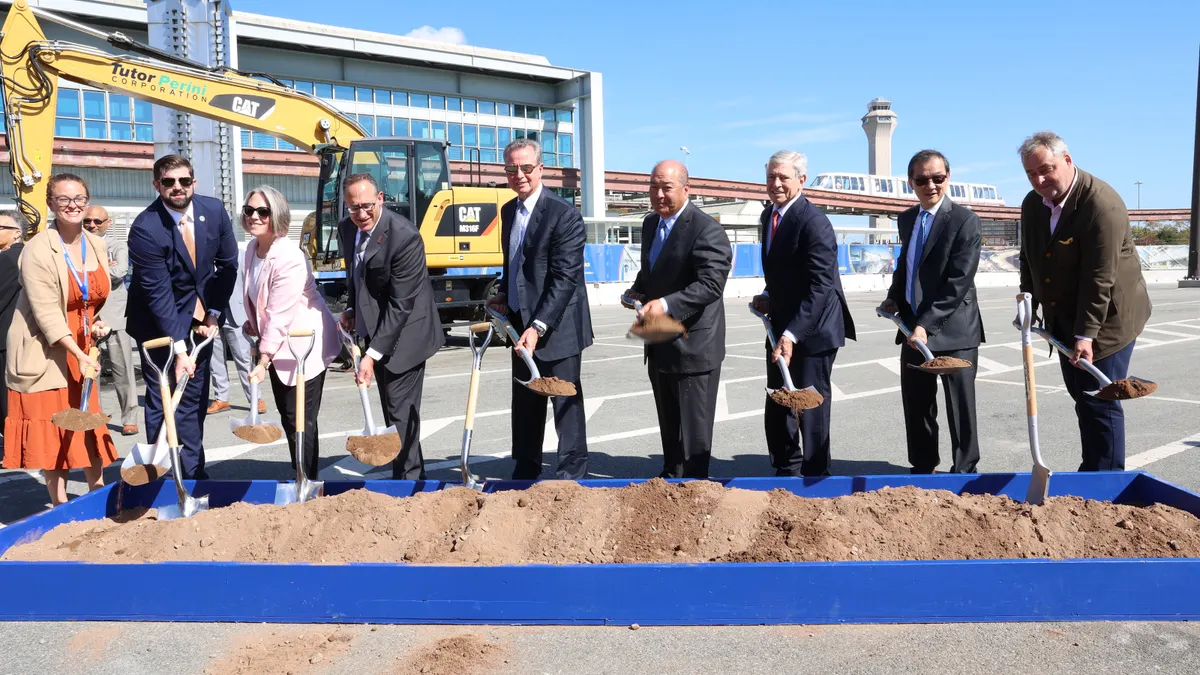 Project stakeholders hold a groundbreaking ceremony